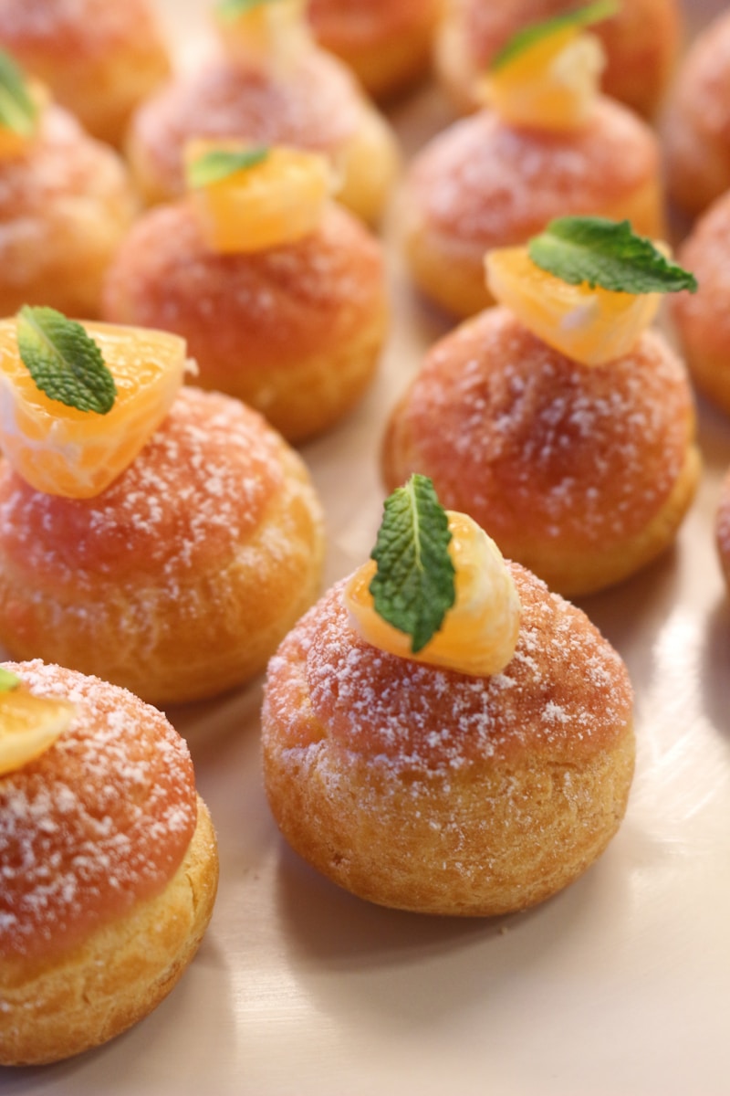 a close up of small pastries on a plate